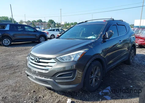 2014 Hyundai Santa Fe Sport 2.4L z USA, uszkodzony, nr VIN 5XYZUDLB4EG207802